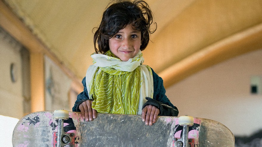 Skate girl holding board