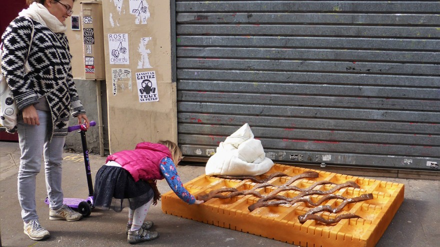 Pedestrians with waffle artwork