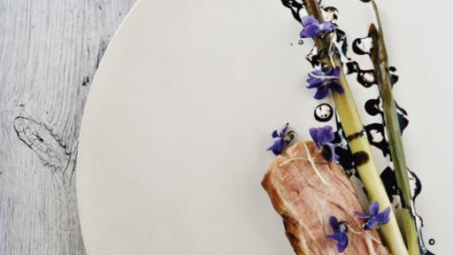 Pork neck with bulrushes, violets and malt. From Noma: Time and Place in Nordic Cuisine. Photo by Ditte Isager. Courtesy of Phaidon Press, www.phaidon.com