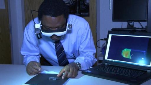 Dr. Samuel Achilefu demonstrates his cancer visualisation glasses.