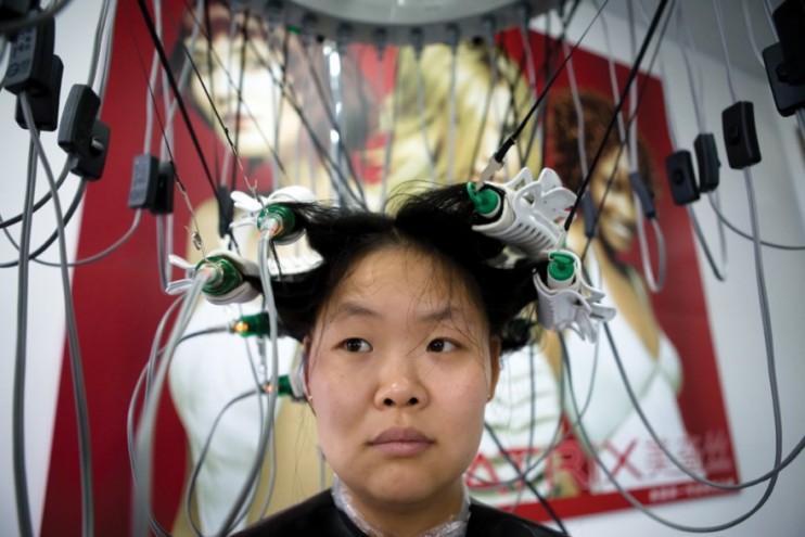 A woman getting her hair curled at the local hair salon. Photo by Patrick Wack.