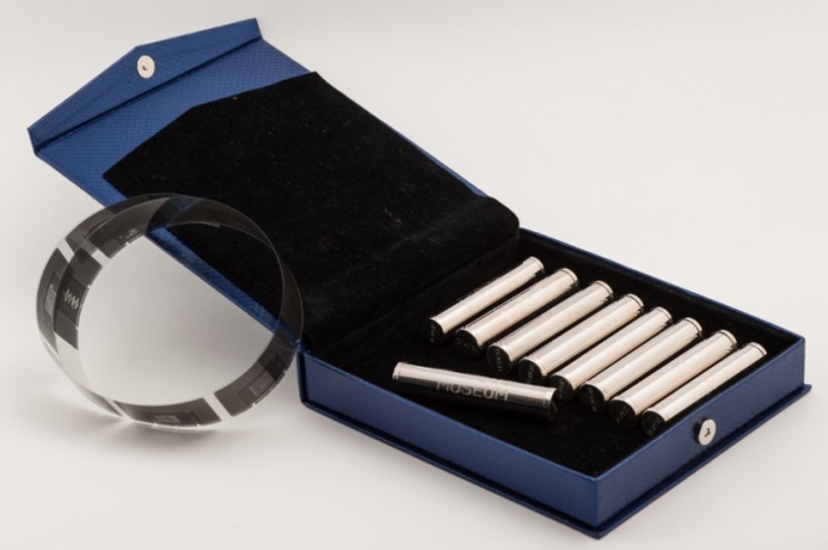 Mini time capsules with mini plans of the new Design Museum.