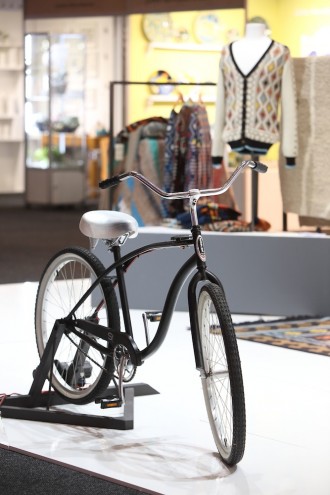 A bicycle on the Mohair SA stand powered a knitting machine that knitted scarfs that will be donated to charity. 