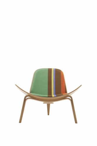 Paul Smith redesigns Carl Hansen & Son's iconic Shell Chair in collaboration with Maharam. 