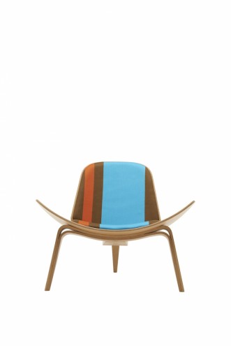 Paul Smith redesigns Carl Hansen & Son's iconic Shell Chair in collaboration with Maharam. 