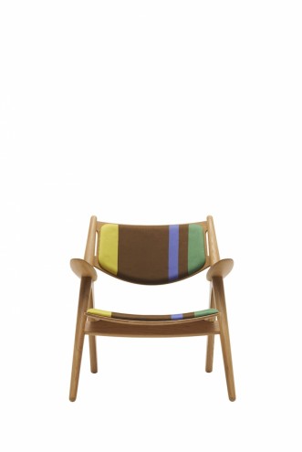 Paul Smith redesigns Carl Hansen & Son's iconic Shell Chair in collaboration with Maharam. 