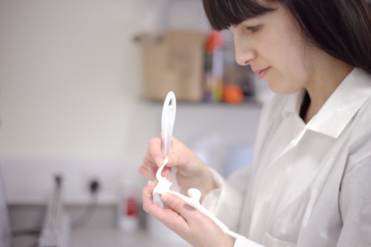 Susannah Clarke checks one of the 3D printed surgical guides.