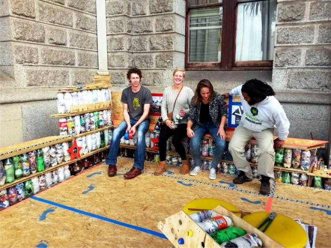 Ian Dommisse (far left) pictured sitting on a bench constructed from EcoBricks and Plywood.