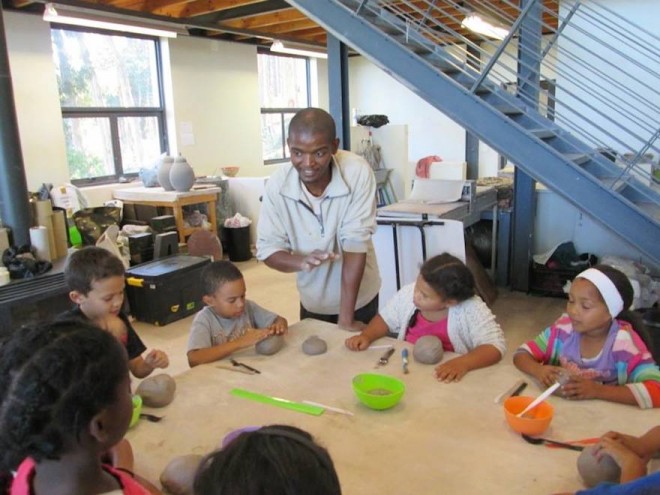 Chuma Maweni teaches children ceramics at Art In The Forest in Constantia.