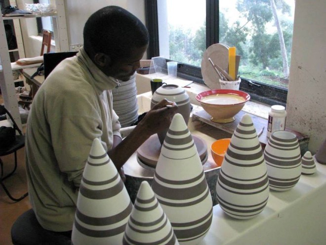 Ceramicist Chuma Maweni works on his tear drop canisters at Art In The Forest in Constantia.