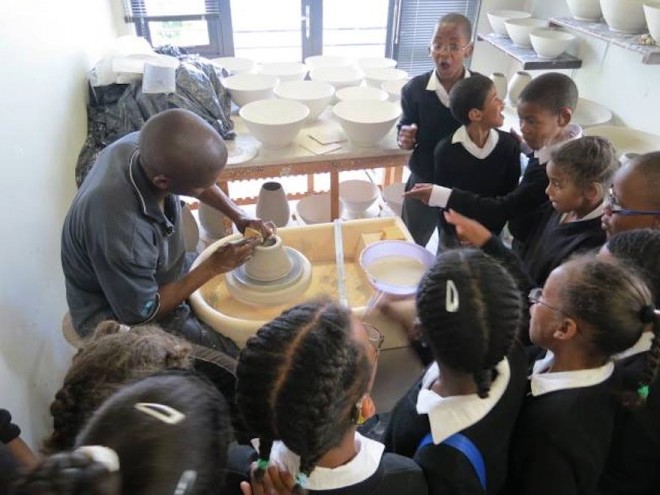 Chuma Maweni teaches children ceramics at Art In The Forest in Constantia.