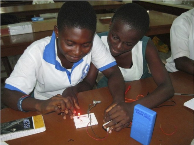 Female students from Ngleshie Amanfro Senior High School in Ghana participate in a light sciences workshop at Ada College of Education in Ghana.