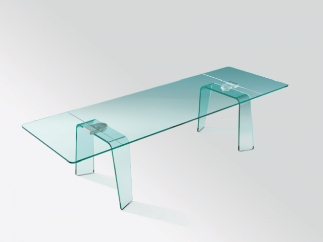The Kayo Extensible Table fo FIAM, made of glass, has a discreet and innovative extendable mechanism embedded in its bent glass legs.