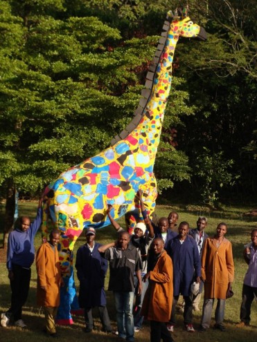 Crafters with their giraffe. 