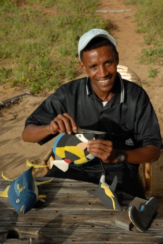 Local crafter making a plastic sculpture. 