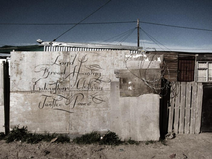 'a letter to the city of cape town from blikkiesdorp  - land, bread, housing, education, clothing, justice, peace.' by Faith47