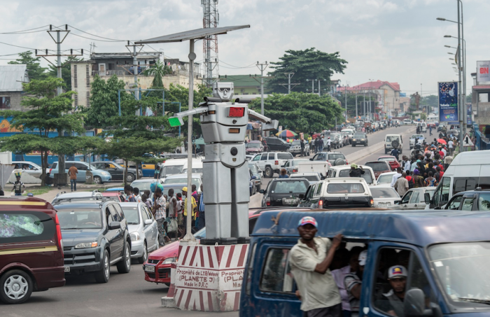 Solar-powered robotic traffic cops have been “hired” to regulate the disorderly traffic in Kinshasa, the capital of the Democratic Republic of Congo. Image: Brian Sokol
