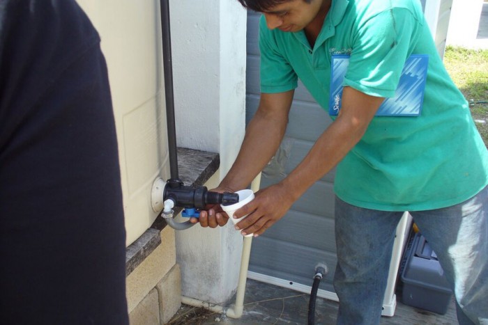 A villager uses MIT's solar powered system. Picture courtesy of MIT 