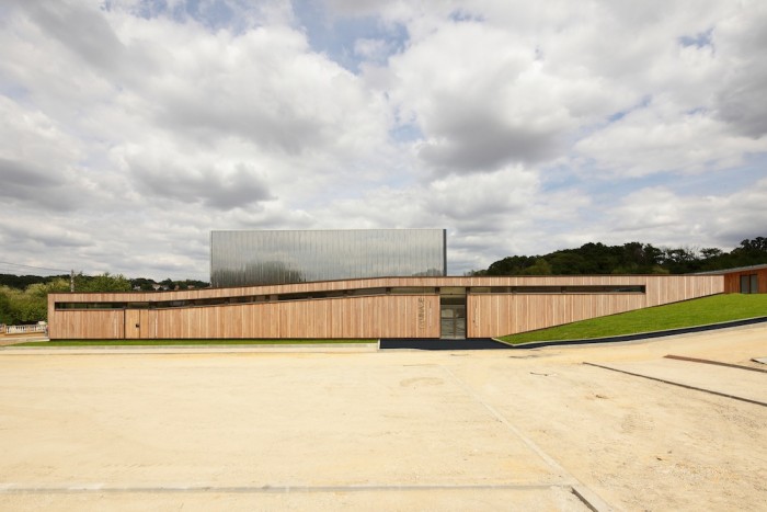 The Bartelottes school complex designed by Paris-based Nomade architects is grounded in the surrounding natural environment.