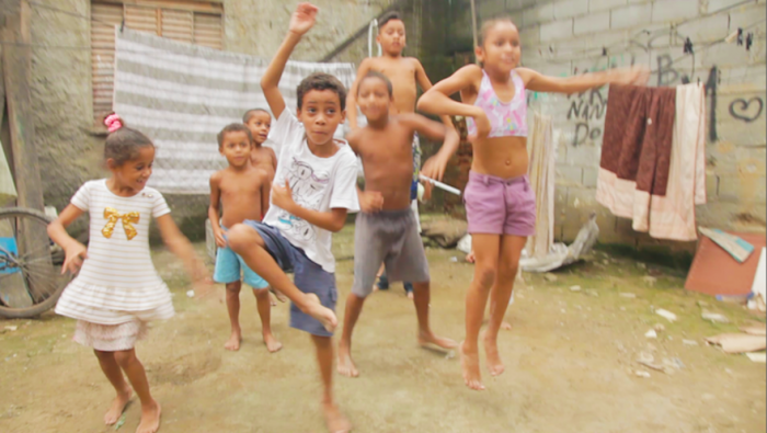 Caetano Fernandes dancing with his siblings in their back yard, Mesquita, Chatuba, Rio de Janeiro, via Liberty Express Kickstarter page