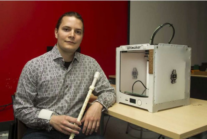 Robert Hunter, engineering PhD student with his winning 3D printed clarinet