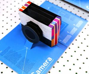 Designer Kelli Anderson has perfected a sequence of cuts and folds that turn a piece of paper into a functional camera that pops up from the centre fold.