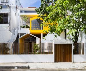 Kientru O Architects converted this building from an old townhouse into a vibrant ochre-and-yellow themed nursery school. 