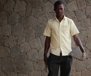 "What makes me happy is that people in this neighbourhood tell me I have done something beautiful here. I will build my house with this stone." Master Mason Hakiza Emmanuel worked on the volcanic stone facades of the Butaro Hospital, Rwanda