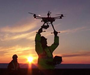 Operator letting go of a drone for testing