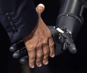 Robotic arm shakes hand