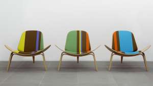 Paul Smith redesigns Carl Hansen & Son's iconic Shell Chair in collaboration with Maharam. 