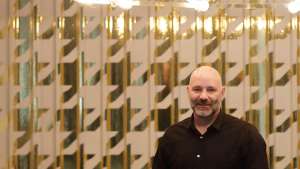 Haldane Martin underneath his new Tesla Chandelier at the LEON At CCIX showroom. Image: Henk Hatting. 