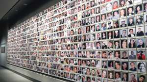 Wall of photos as 9/11 Memorial Museum. 