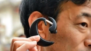 A PC worn in the user's ear.