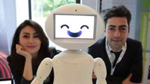 LuxAI's robot with Aida Nazariklorram, co-founder and Chief Medical Officer, and Dr. Pouyan Ziafati, founder and CEO
