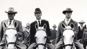 The commando of National Party stalwarts which escorted prime minister and National Party leader Hendrik Verwoerd and his wife Betsie to the party's 50th anniversary celebrations at de Wildt, Transvaal. Image: David Goldblatt. 